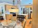 Bright kitchen with wooden cabinetry, granite countertops, stainless steel appliances, and island with seating at 4025 Mcdowell Dr, Acworth, GA 30101