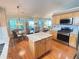 Bright kitchen featuring a kitchen island, stainless steel appliances, and natural wood cabinets at 4025 Mcdowell Dr, Acworth, GA 30101