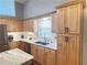 Kitchen area featuring wood cabinets, granite counter tops, and stainless steel appliances at 4025 Mcdowell Dr, Acworth, GA 30101