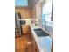 Kitchen features stainless steel sink, granite counter tops, and wood cabinetry at 4025 Mcdowell Dr, Acworth, GA 30101