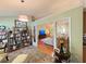 Open-concept floor plan with a view to a living room and sitting room, and hardwood floors at 4025 Mcdowell Dr, Acworth, GA 30101
