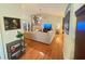 Spacious living room with hardwood floors and cozy fireplace at 4025 Mcdowell Dr, Acworth, GA 30101