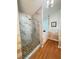 Shower featuring stunning tile and glass with a view into the main bathroom at 4025 Mcdowell Dr, Acworth, GA 30101
