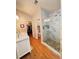 Bright bathroom offering double sinks, a glass shower, and entry to a walk-in closet at 4025 Mcdowell Dr, Acworth, GA 30101