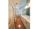 Well-lit bathroom with double sinks, granite countertops, and tile accents at 4025 Mcdowell Dr, Acworth, GA 30101