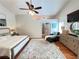 Bright primary bedroom boasts a vaulted ceiling, a ceiling fan, and hardwood flooring at 4025 Mcdowell Dr, Acworth, GA 30101