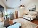 Spacious primary bedroom featuring hardwood floors, a ceiling fan, and natural lighting at 4025 Mcdowell Dr, Acworth, GA 30101