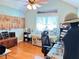 Well-lit studio with ceiling fan and hardwood floors provides ample room for hobbies at 4025 Mcdowell Dr, Acworth, GA 30101