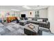 Spacious finished basement with plush seating, game table, and natural light at 4841 Village North Ct, Atlanta, GA 30338