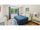 Comfortable bedroom featuring natural light and calming neutral tones at 4841 Village North Ct, Atlanta, GA 30338