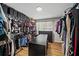 Walk-in closet with a dark counter, a window, and plenty of rack and shelf space at 4841 Village North Ct, Atlanta, GA 30338