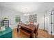 Elegant dining room featuring a large wooden table and ample natural light at 4841 Village North Ct, Atlanta, GA 30338