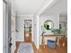 Inviting entryway with wood floors, a console table and a view of the kitchen beyond at 4841 Village North Ct, Atlanta, GA 30338
