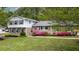 Charming two-story home with beautiful landscaping and brick facade at 4841 Village North Ct, Atlanta, GA 30338