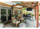 Covered patio with ceiling fan and outdoor seating area at 4841 Village North Ct, Atlanta, GA 30338