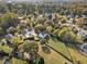 Aerial view of home showcasing large backyard, surrounding neighborhood, and proximity to a lake at 946 Steadman Ter, Marietta, GA 30064