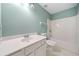 Bathroom featuring a vanity, toilet, and shower-tub combo with white tile at 946 Steadman Ter, Marietta, GA 30064