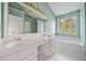 Bathroom features a soaking tub, double sink vanity, and a large mirror at 946 Steadman Ter, Marietta, GA 30064