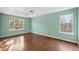 This bright bedroom includes hardwood floors and two windows for natural light at 946 Steadman Ter, Marietta, GA 30064