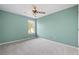 Cozy bedroom showcasing a window, carpet flooring, and a ceiling fan at 946 Steadman Ter, Marietta, GA 30064