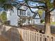 Charming two-story home with a well-manicured front yard, picket fence, and classic white siding at 946 Steadman Ter, Marietta, GA 30064