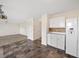 Cozy eat-in kitchen leading to the living area, complete with white appliances at 946 Steadman Ter, Marietta, GA 30064