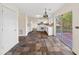 Eat-in kitchen with white cabinets, stone tile flooring, and sliding glass doors at 946 Steadman Ter, Marietta, GA 30064