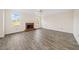 Bright and spacious living room featuring a fireplace, LVP floors, and multiple windows at 946 Steadman Ter, Marietta, GA 30064