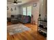 Cozy living room with hardwood floors, a comfortable gray sectional, and stylish decor at 2007 Mesa Se Dr, Atlanta, GA 30316