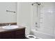 Traditional bathroom featuring a wooden vanity with laminate countertop and combination tub and shower at 2225 Bigwood Trl, Atlanta, GA 30349