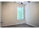 Bedroom featuring neutral paint, a window and ceiling fan at 2225 Bigwood Trl, Atlanta, GA 30349