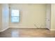 Bright, airy bedroom with vinyl flooring and a window, providing a simple and serene atmosphere at 2225 Bigwood Trl, Atlanta, GA 30349