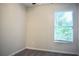 Bedroom featuring neutral paint, a window and ceiling fan at 2225 Bigwood Trl, Atlanta, GA 30349