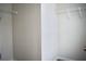 Walk-in closet features a neutral-colored wall and white shelving with carpeted flooring at 2225 Bigwood Trl, Atlanta, GA 30349
