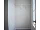 Cozy walk-in closet boasts white wire shelving and neutral colored walls at 2225 Bigwood Trl, Atlanta, GA 30349