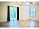 Bright living room with sliding glass doors leading to outdoor space, complemented by modern ceiling fan at 2225 Bigwood Trl, Atlanta, GA 30349