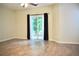 Open living room with vinyl floors, offering access to the outdoors through a sliding glass door, creating an airy feel at 2225 Bigwood Trl, Atlanta, GA 30349