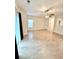 Spacious living room with vinyl floors, complemented by a ceiling fan and natural light from sliding glass doors at 2225 Bigwood Trl, Atlanta, GA 30349