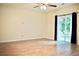 Bright living room featuring hardwood floors and a sliding glass door that fills the space with natural light at 2225 Bigwood Trl, Atlanta, GA 30349