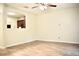 Open-concept living room with wood-look floors and ceiling fan at 2225 Bigwood Trl, Atlanta, GA 30349