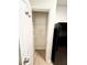 Spacious pantry with wire shelving and a modern refrigerator nearby, perfect for kitchen organization at 2225 Bigwood Trl, Atlanta, GA 30349