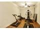 Home gym with wood flooring and a variety of equipment for a complete workout experience at 225 Mystic Ridge Hl, Sandy Springs, GA 30342