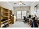 Versatile home office with a desk, shelving and natural light, creating a productive work environment at 225 Mystic Ridge Hl, Sandy Springs, GA 30342