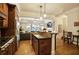 Well-equipped kitchen featuring stainless steel appliances, granite countertops, and access to the living area at 225 Mystic Ridge Hl, Sandy Springs, GA 30342