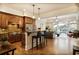 Open concept kitchen with hardwood floors, modern appliances, and an island with bar stool seating at 225 Mystic Ridge Hl, Sandy Springs, GA 30342