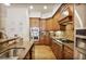 Gourmet kitchen with custom cabinetry, granite countertops, and stainless steel appliances perfect for cooking at 225 Mystic Ridge Hl, Sandy Springs, GA 30342