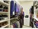 Organized walk-in closet with shelving and hanging space for clothes, shoes and accessories at 225 Mystic Ridge Hl, Sandy Springs, GA 30342