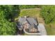 A high angle shows the fenced-in yard and well-maintained landscaping surrounding the brick home at 1213 Blue Springs Dr, Loganville, GA 30052