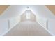 Bright attic space with neutral carpet, great for storage or a playroom at 1213 Blue Springs Dr, Loganville, GA 30052