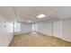Basement with neutral carpet, window, and door to the exterior at 1213 Blue Springs Dr, Loganville, GA 30052